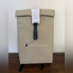 NWT. Rains Rolltop Rucksack Backpack. Color Sand.